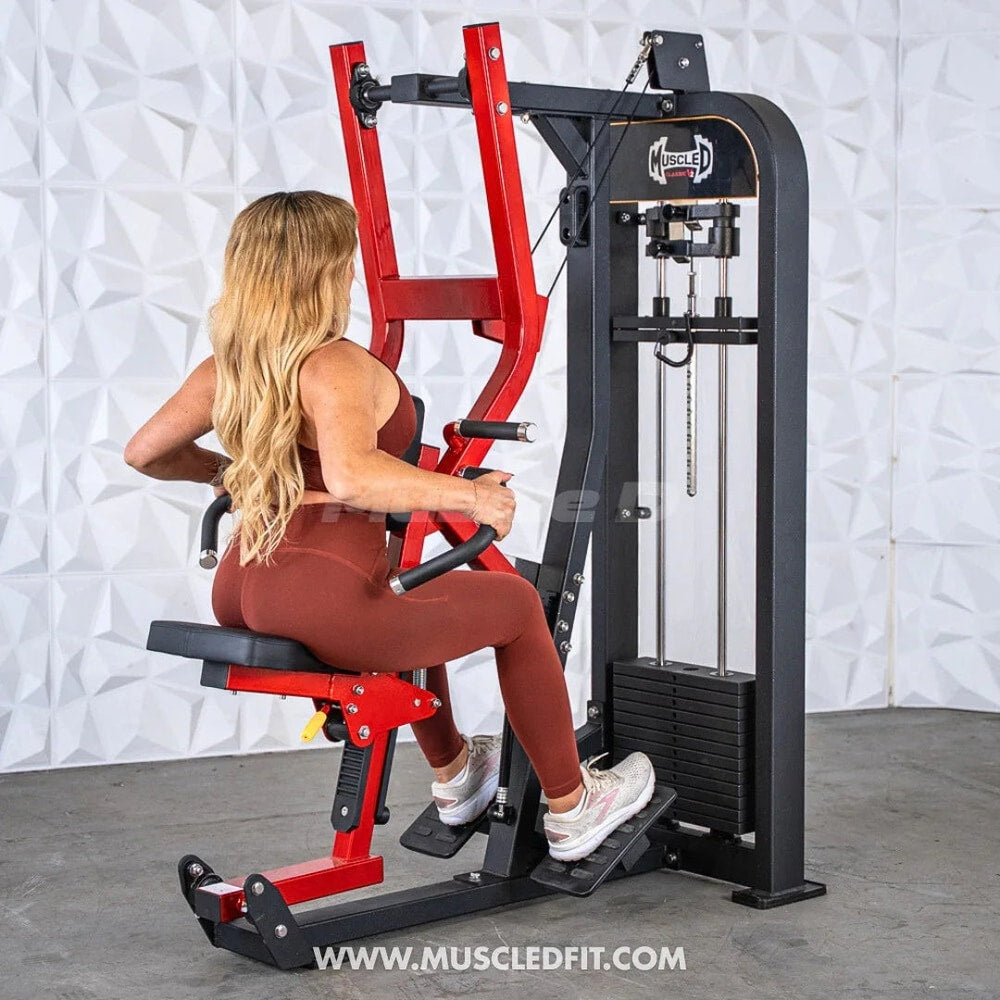 Woman using seated row machine in gym for strength training