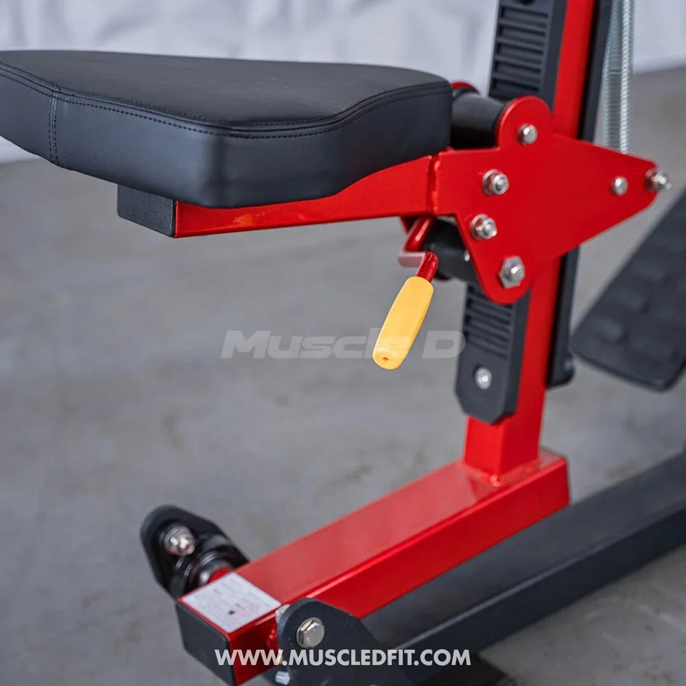 Close-up of adjustable seat and frame on red seated row gym machine for home fitness