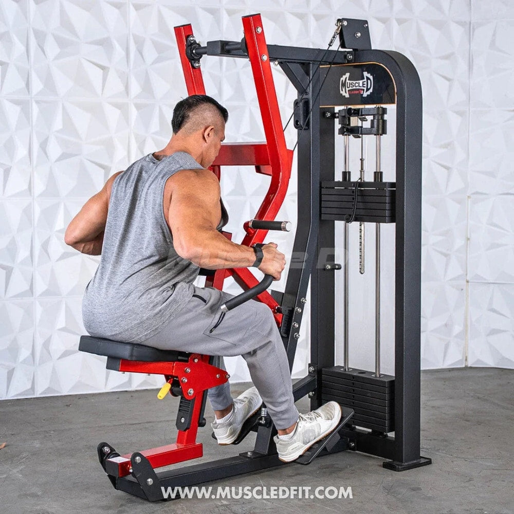 Man using a commercial seated row machine for strength training in a gym setting