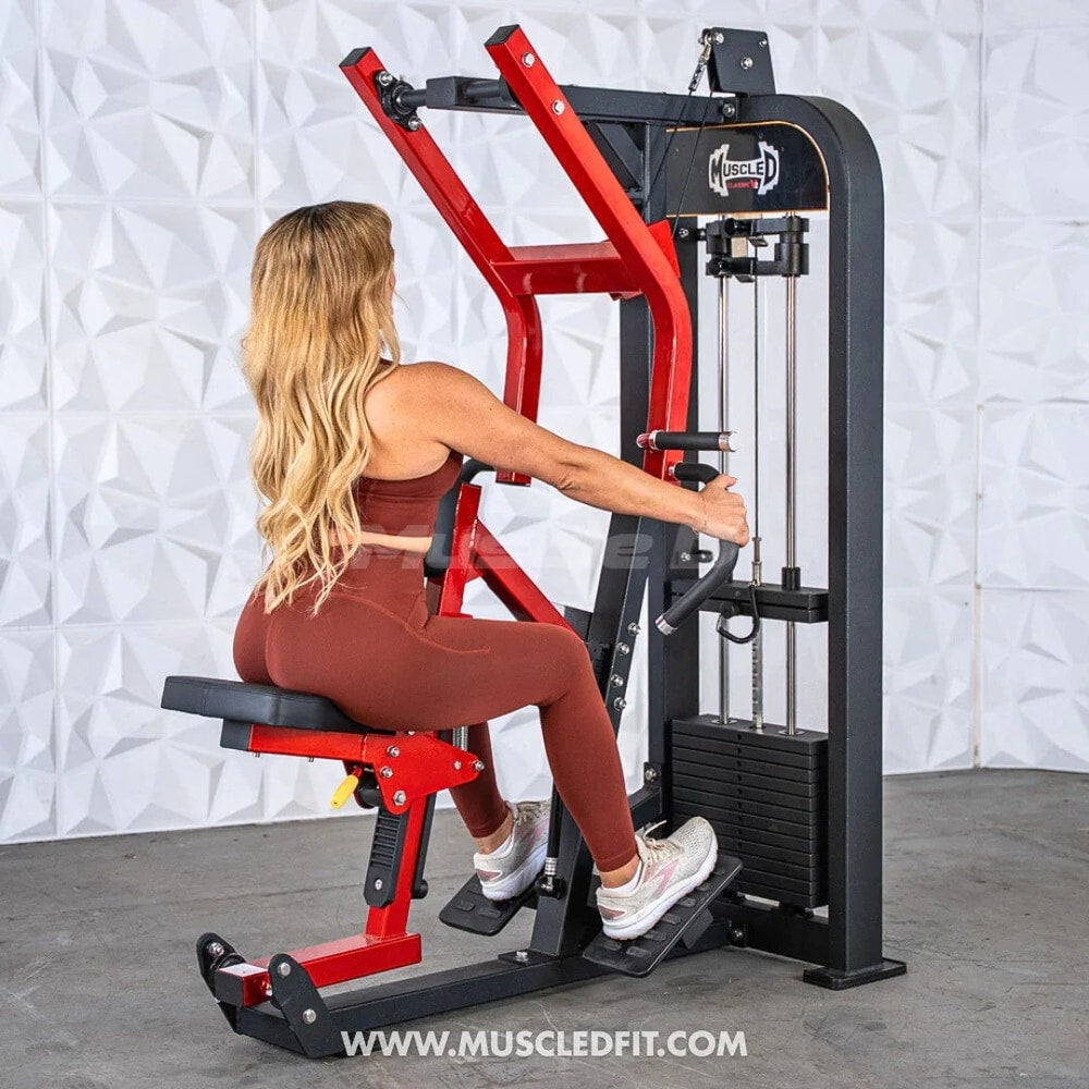 Woman using a seated row strength training machine in a modern fitness space