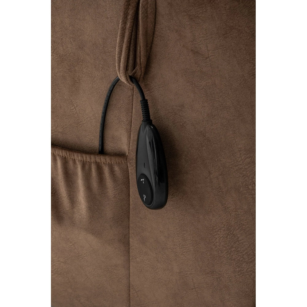 Black remote control for recliner chair in side pocket on brown fabric upholstery