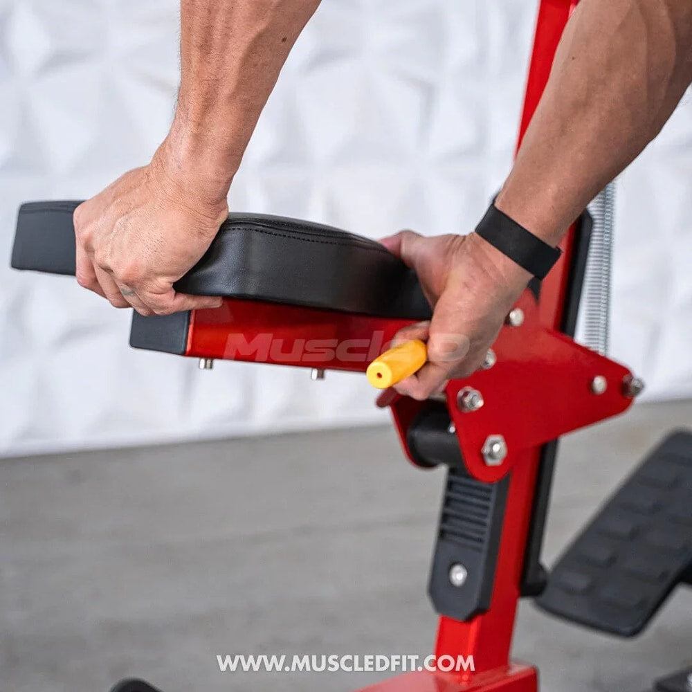 Person adjusting seat height on red seated row gym machine with padded cushion