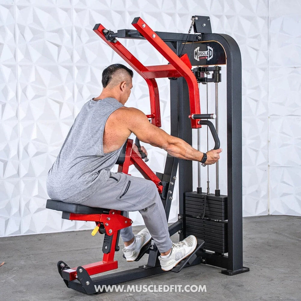 Man using seated row machine for strength training in modern home gym setting
